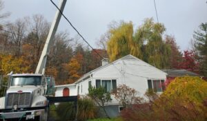 The Hill Treekeepers crane preparing to remove a tree outside Newburgh, NY.